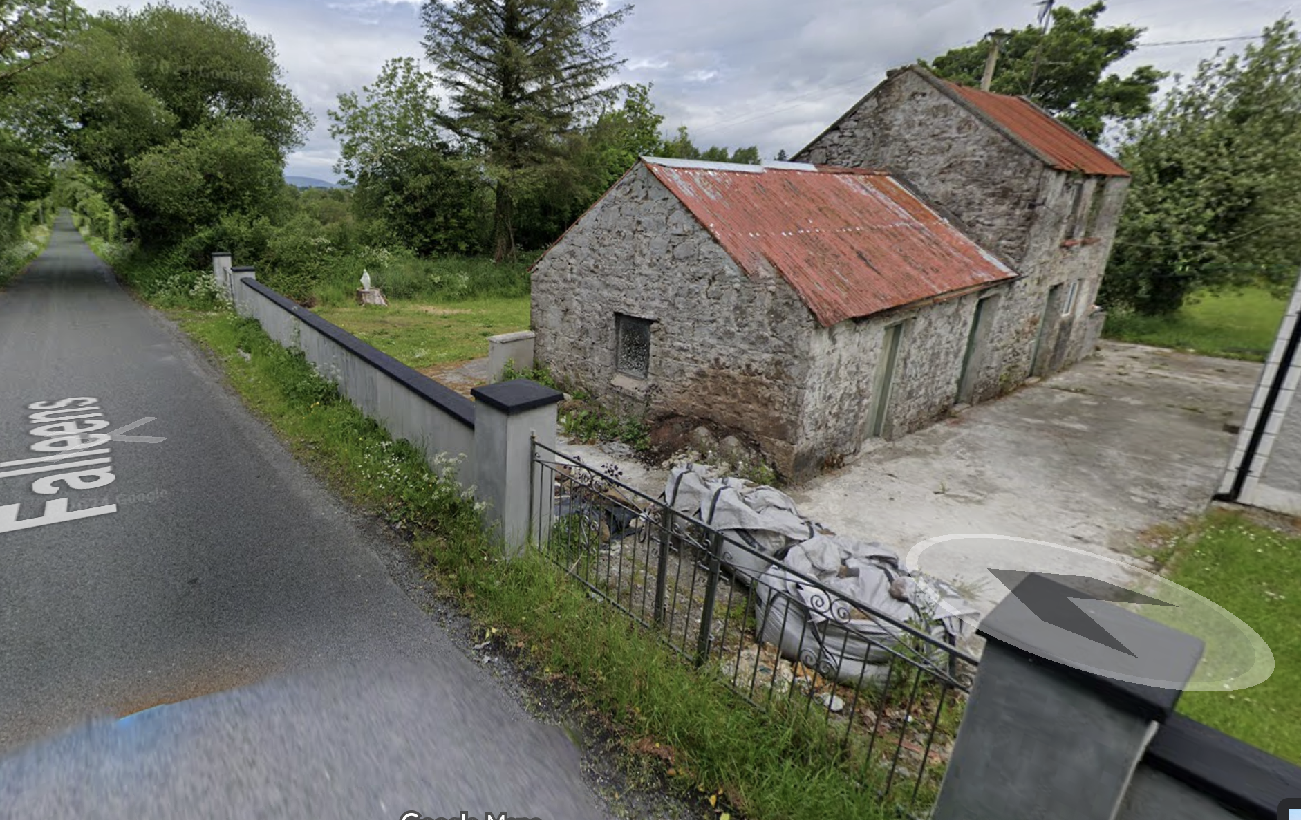 Stone cottage in Falleens, Co. Sligo with road sign